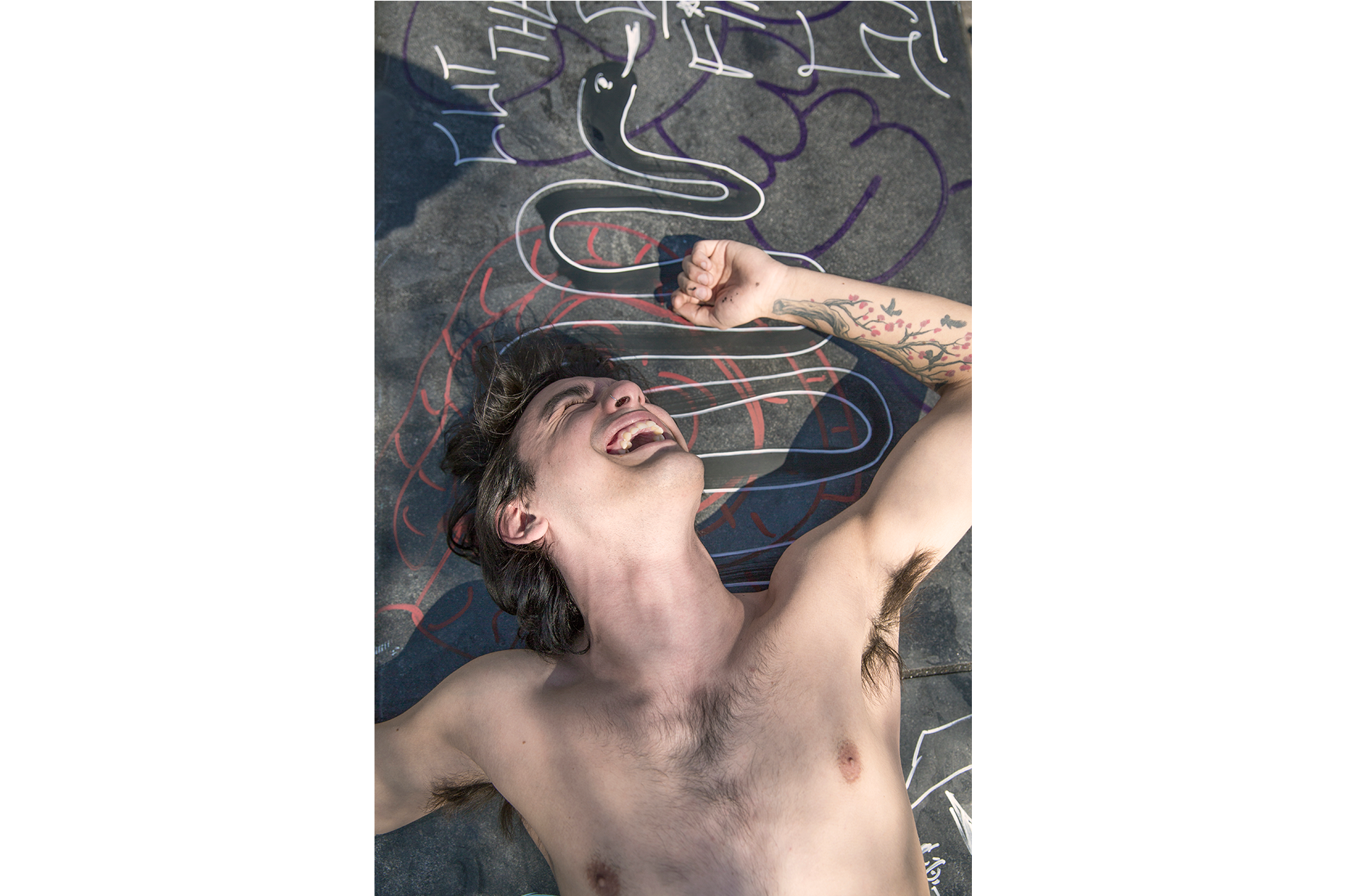 19_Man-lying-down-on-graffiti
